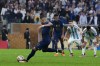 France's Kylian Mbappe scores from the penalty spot his side's third goal during the World Cup final soccer match between Argentina and France at the Lusail Stadium in Lusail, Qatar, Sunday, Dec. 18, 2022. (AP Photo/Natacha Pisarenko)