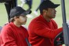 Tiger Woods, right, and Charlie Woods, left, drive down the 3rd fairway during the final round of the PNC Championship golf tournament Sunday, Dec. 18, 2022, in Orlando, Fla. (AP Photo/Kevin Kolczynski)