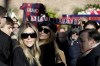 The wife of former soccer player Sinisa Mihajlovic, Arianna, centre and other family members look on, ahead of his funeral service, in Rome, Italy, Monday, Dec. 19, 2022. Former soccer player and coach Mihajlovic died at 53 after a long battle with leukemia. Mihajlovic’s family announced Friday that he died in a Rome hospital. (Cecilia Fabiano /LaPresse via AP)