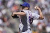 FILE - New York Mets' Seth Lugo winds up during a baseball game against the San Francisco Giants in San Francisco, May 25, 2022. Free-agent reliever Lugo and the San Diego Padres have agreed on a $15 million, two-year contract, according to a person with knowledge of the deal. The person spoke to The Associated Press on condition of anonymity because the agreement was pending a physical and no announcement had been made. (AP Photo/Jeff Chiu, File)