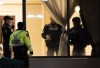 Police are seen in the lobby of a condo building following a shooting in Vaughan, Ont., Sunday, Dec. 18, 2022.A 66-year-old woman who was shot in a rampage at a condominium north of Toronto is going to live, but has a long road to recovery.&nbsp;THE CANADIAN PRESS/Arlyn McAdorey