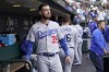 FILE - Los Angeles Dodgers' Cody Bellinger stands in the dugout before the team's baseball game against the San Francisco Giants in San Francisco, Aug. 2, 2022. Cody Bellinger is looking forward to a fresh start with the Chicago Cubs and showing that he can once again be a productive hitter. He gets a chance to prove it with the Cubs, after agreeing to a $17.5 million, one-year contract three weeks ago. (AP Photo/Jeff Chiu, File)