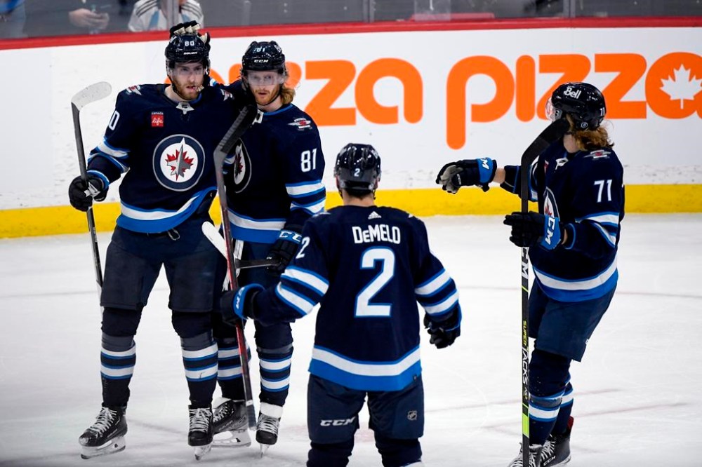 THE CANADIAN PRESS/Fred Greenslade
Winnipeg Jets’ Kyle Connor (81) celebrates his goal against the Ottawa Senators with Pierre-Luc Dubois (80), Dylan Demelo (2) and Axel Jonsson-Fjallby (71) during the second period.