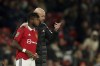 Manchester United's head coach Erik ten Hag, right gestures as he speaks to substitute Manchester United's Fred during the English League Cup 4th round soccer match between Manchester United and Burnley, at Old Trafford in Manchester, England Wednesday, Dec. 21, 2022. (AP Photo/Dave Thompson)