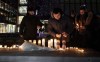 Members of the public attend a candlelight vigil for victims of a mass shooting in Vaughan, Ont., on Wednesday, Dec. 21, 2022. THE CANADIAN PRESS/Arlyn McAdorey