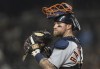 FILE - Detroit Tigers catcher Tucker Barnhart is pictured during the second game of a baseball doubleheader against the Seattle Mariners, Tuesday, Oct. 4, 2022, in Seattle. The Chicago Cubs bolstered their defense again on Thursday, Dec. 22, 2022, agreeing to a contract with Gold Glove-winning catcher Tucker Barnhart.(AP Photo/Stephen Brashear, File)