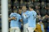 Manchester City players celebrate after Manchester City's Nathan Ake scored his side's third goal during the English League Cup soccer match between Manchester City and Liverpool at Etihad stadium in Manchester, England, Thursday, Dec. 22, 2022. (AP Photo/Jon Super)