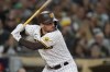 FILE - San Diego Padres' Brandon Drury bats during the third inning of the team's baseball game against the San Francisco Giants, Oct. 3, 2022, in San Diego. Drury has agreed to a $17 million, two-year contract with the Los Angeles Angels. Right-hander Oliver Ortega was designated for assignment Thursday, Dec. 22, to make room on the Angels' 40-man roster for Drury, who hit a career-best 28 homers last season while playing for Cincinnati and San Diego. He won the Silver Slugger award as a utility player. (AP Photo/Gregory Bull, File)
