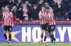 Brentford's Vitaly Janelt, right, celebrates with Christian Norgaard, centre, after scoring the opening goal during the English Premier League soccer match between Brentford and Tottenham Hotspur at the Gtech Community Stadium in London, Monday, Dec. 26, 2022. (AP Photo/Kirsty Wigglesworth)