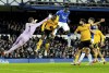 Wolverhampton Wanderers' goalkeeper Jose Sa, left, tries to punch away the ball during the Premier League soccer match between FC Everton and Wolverhampton Wanderers at Goodison Park in Liverpool, England, Monday, Dec. 26, 2022. (AP Photo/Jon Super)