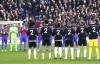 Fulham players wear tracksuit tops with the name of former player George Cohen during a minute silence, prior to the English Premier League soccer match between Crystal Palace and Fulham, at Selhurst Park, London, Monday, Dec. 26, 2022. Cohen, a defender who played on England's World Cup-winning team in 1966 died, Friday, Dec. 23, 2022. He was 83. (Zac Goodwin/PA via AP)