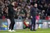 Southampton manager Nathan Jones, right, and Brighton's manager Roberto De Zerbi give instructions during the Premier League soccer match between Southampton and Brighton, at St. Mary's Stadium in Southampton, England, Monday Dec. 26, 2022. (Adam Davy/PA via AP)