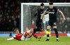 Arsenal's Martin Odegaard, left, duels for the ball with West Ham's Lucas Paqueta, left and West Ham's Declan Rice during the English Premier League soccer match between Arsenal and West Ham United at Emirates stadium in London, Monday, Dec. 26, 2022. (AP Photo/David Cliff)