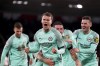 Brighton's Solly March, centre, celebrates with his team mates after scoring his sides third goal of the game during the Premier League soccer match between Southampton and Brighton, at St. Mary's Stadium in Southampton, England, Monday Dec. 26, 2022. (Adam Davy/PA via AP)