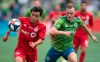 Toronto FC forward Tsubasa Endoh (31) fights for control of the ball with Seattle Sounders defender Brad Smith (11) during the first half of MLS Cup final soccer action in Seattle on Sunday, November, 10, 2019.&nbsp;Endoh is underging treatment in his native Japan for acute leukemia. THE CANADIAN PRESS/Jonathan Hayward