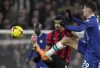 Bournemouth's Dominic Solanke, center, duels for the ball with Chelsea's Kai Havertz during the English Premier League soccer match between Chelsea and Bournemouth at Stamford Bridge Stadium in London, Tuesday, Dec. 27, 2022. (AP Photo/Kin Cheung)