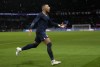 PSG's Kylian Mbappe celebrates after scoring his side's second goal from penalty spot during the French League One soccer match between Paris Saint-Germain and Strasbourg at the Parc des Princes in Paris, Wednesday, Dec. 28, 2022. (AP Photo/Thibault Camus)
