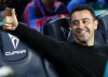 FILE - Barcelona's head coach Xavi Hernandez gives a thumbs up before a Spanish La Liga soccer match between FC Barcelona and Celta Vigo at Camp Nou stadium in Barcelona, Spain, Oct. 9, 2022. Barcelona and Real Madrid resume their fight for the Spanish league title as the competition starts again following a seven-week hiatus for the World Cup. Barcelona has a two-point lead and hosts Espanyol at Camp Nou on Saturday Dec. 31, 2022, a day before defending champion Madrid visits Valladolid. (AP Photo/Joan Monfort, File)