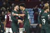 Liverpool's Andrew Robertson, left, and Liverpool's Stefan Bajcetic celebrate after final whistle of the English Premier League soccer match between Aston Villa and Liverpool at Villa Park in Birmingham, England, Monday, Dec. 26, 2022. (AP Photo/Rui Vieira)