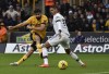 Wolverhampton Wanderers' Diego Costa, left, kicks the ball during the English Premier League soccer match between Wolverhampton Wanderers and Manchester United at the Molineux Stadium in Wolverhampton, England, Saturday, Dec. 31, 2022. (AP Photo/Rui Vieira)