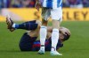 Barcelona's Robert Lewandowski holds his head during a Spanish La Liga soccer derby match between Barcelona and Espanyol at the Camp Nou stadium in Barcelona, Spain, Saturday, Dec. 31, 2022. (AP Photo/Joan Monfort)