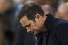 Everton's head coach Frank Lampard looks down as he arrives to take his seat on the bench before the English Premier League soccer match between Manchester City and Everton at the Etihad Stadium in Manchester, England, Saturday, Dec. 31, 2022. (AP Photo/Dave Thompson)