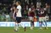 Tottenham's Harry Kane acknowledges the fans after their loss in the English Premier League soccer match between Tottenham Hotspur and Aston Villa at Tottenham Hotspur Stadium in London, Sunday, Jan. 1, 2023. (AP Photo/Ian Walton)