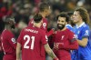 Liverpool's Mohamed Salah, second right, celebrates with teammates at the end of the English Premier League soccer match between Liverpool and Leicester City at Anfield stadium in Liverpool, England, Friday, Dec. 30, 2022. (AP Photo/Jon Super)