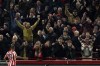 Brentford's Bryan Mbeumo celebrates after scoring his side's third goal during the English Premier League soccer match between Brentford and Liverpool at the Gtech Community Stadium in London, Monday, Jan. 2, 2023. (AP Photo/Ian Walton)