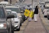 Vendors sell flags with Cristiano Ronaldo's number seven ahead of his official unveiling as a new member of Al Nassr soccer club in in Riyadh, Saudi Arabia, Tuesday, Jan. 3, 2023. Ronaldo, who has won five Ballon d'Ors awards for the best soccer player in the world and five Champions League titles, will play outside of Europe for the first time in his storied career. (AP Photo/Amr Nabil)