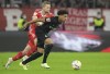 FILE - Freiburg's Kevin Schade, right, challenges Bayern's Matthijs de Ligt for the ball during the German Bundesliga soccer match between FC Bayern Munich and SC Freiburg at the Allianz Arena in Munich, Germany, Oct. 16, 2022. Brentford has signed German winger Kevin Schade as the West London club seeks to build for the future after establishing itself in the English Premier League. (AP Photo/Matthias Schrader, File)