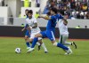 Kuwait's Bader Tareq, center, fights for the ball against Iraq's players, during a friendly football match between Kuwait and Iraq at the Sports City Stadium in Basra, Iraq, on Friday, Dec. 30, 2022. Iraq defeated Kuwait by 1-0. (AP Photo/Nabil al-Jurani)