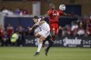 Toronto FC defender Chris Mavinga (23) and Los Angeles Galaxy forward Javier Hernández (14) jump for a ball during first half MLS soccer action in Toronto on Wednesday, Aug. 31, 2022.&nbsp;Mavinga, who spent the last six seasons with Toronto FC, has signed with the Los Angeles Galaxy. THE&nbsp;CANADIAN PRESS/Cole Burston