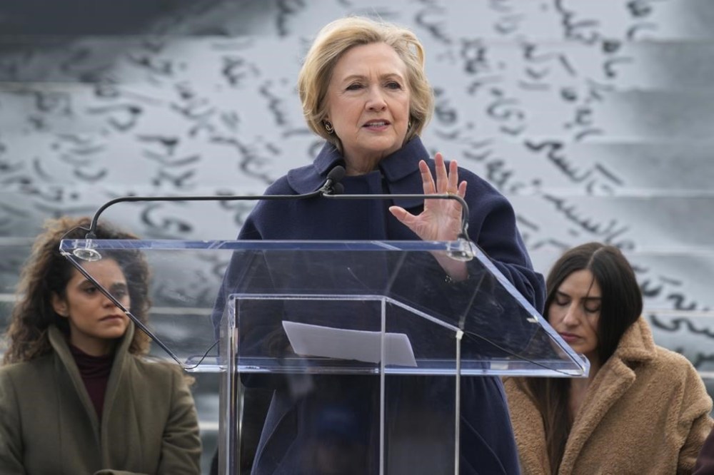 FILE - Former Secretary of State Hillary Clinton speaks at a press preview of an art installation entitled