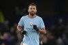 Manchester City's Riyad Mahrez celebrates after scoring the opening goal during the English Premier League soccer match between Chelsea and Manchester City at Stamford Bridge stadium in London Thursday, Jan. 5, 2023. (AP Photo/Kirsty Wigglesworth)