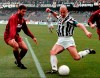 FILE - Former Italian national soccer team striker Gianluca Vialli, right, kicks the ball under the gaze of Torino's defender Sean Sogliano during their Italian Serie A soccer match at the Delle Alpi stadium in Turin, Italy, Saturday, April 6, 1996. Gianluca Vialli, the former Italy striker who helped both Sampdoria and Juventus win Serie A and European trophies before becoming a player-manager at Chelsea, has died on Friday, Jan. 6, 2023. He was 58. (AP Photo/Mauro Pilone, File)