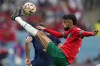 Morocco's Noussair Mazraoui connects a shot during the World Cup semifinal soccer match between France and Morocco at the Al Bayt Stadium in Al Khor, Qatar, Wednesday, Dec. 14, 2022. (AP Photo/Natacha Pisarenko)