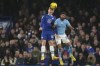 Chelsea's Lewis Hall, left, and Manchester City's Riyad Mahrez challenge for the ball during the English Premier League soccer match between Chelsea and Manchester City at Stamford Bridge stadium in London Thursday, Jan. 5, 2023. (AP Photo/Kirsty Wigglesworth)