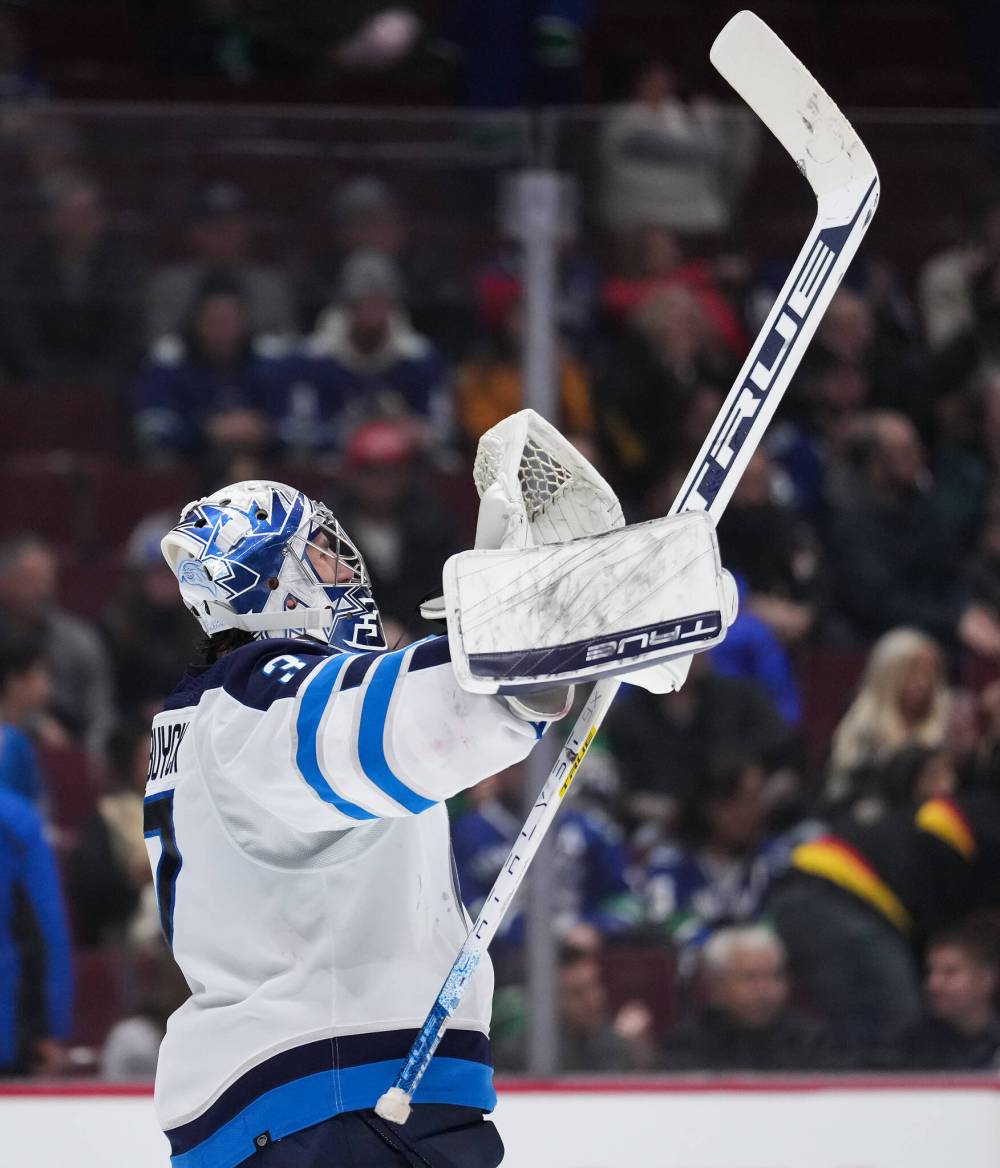DARRYL DYCK / THE CANADIAN PRESS
Winnipeg Jets goalie Connor Hellebuyck celebrates after Winnipeg defeats the Vancouver Canucks 5-1.