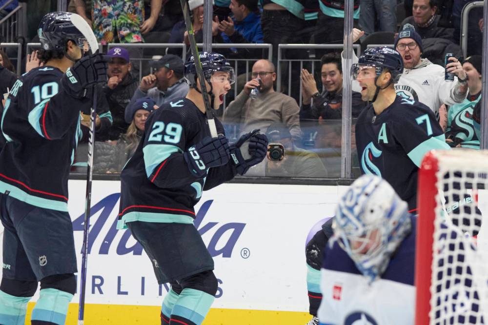 JOHN FROSCHAUER / THE ASSOCIATED PRESS
Seattle Kraken right wing Jordan Eberle (7) celebrates his goal with defenseman Carson Soucy, center Matty Beniers after scoring against the Winnipeg Jets during the second period.