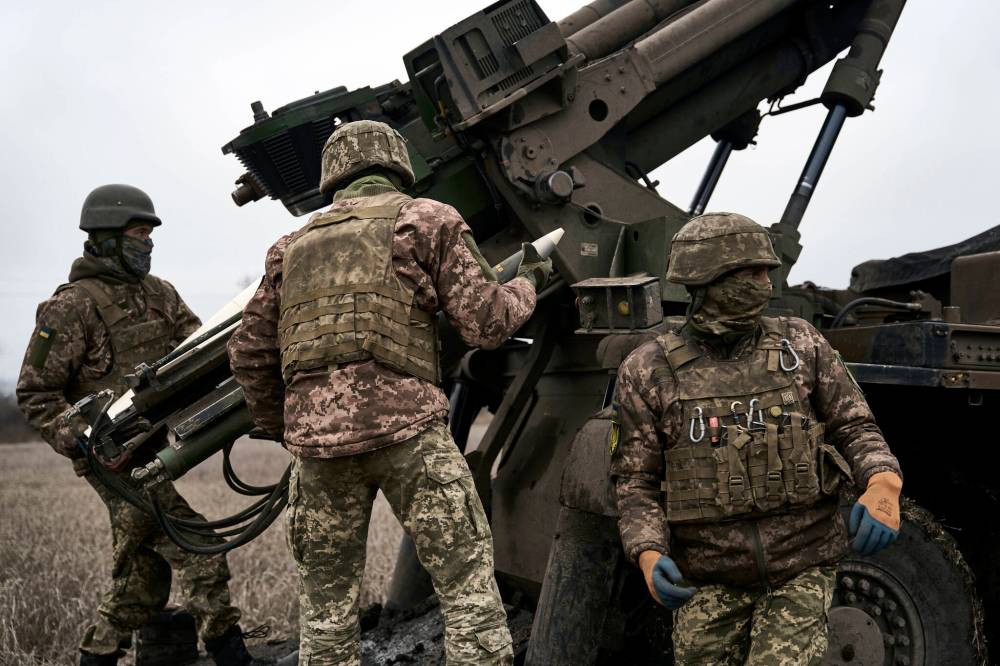 Libkos / The Associated Press files
                                Ukrainian soldiers prepare to fire a French-made CAESAR self-propelled howitzer towards Russian positions in the Donetsk region of Ukraine on Dec. 26.