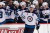 Winnipeg Jets’ Mark Scheifele returns to the bench in the second period after scoring his first of two goals in the Jets 4-1 win against the Pittsburgh Penguins in Pittsburgh, Friday. (AP Photo/Gene J. Puskar)