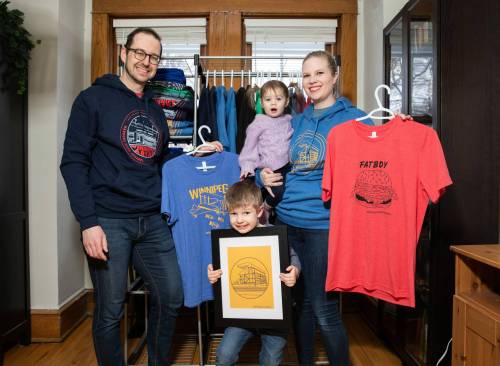 JESSICA LEE / WINNIPEG FREE PRESS 

Heather and Sid Barkman and their children Penny, 1, and Arthur, 4, show off some of the imagery featured by Maroons Road Apparel.