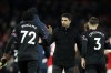 Arsenal's manager Mikel Arteta, center, shakes hands with West Ham players at the end of the English Premier League soccer match between Arsenal and West Ham United at Emirates stadium in London, Monday, Dec. 26, 2022. (AP Photo/David Cliff)