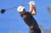 Collin Morikawa plays his shot from the 13th tee during the final round of the Tournament of Champions golf event, Sunday, Jan. 8, 2023, at Kapalua Plantation Course in Kapalua, Hawaii. (AP Photo/Matt York)