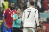 FILE - Referee Stephanie Frappart talks with Germany's Kai Havertz during the World Cup group E soccer match between Costa Rica and Germany at the Al Bayt Stadium in Al Khor, Qatar, on Dec.1, 2022. The six female match officials who worked at the men’s World Cup in Qatar including history maker Stephanie Frappart were also selected Monday Jan. 9, 2023 by FIFA for the 2023 Women’s World Cup, which will have 13 men in the video review team. (AP Photo/Moises Castillo, File)