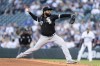 FILE - Chicago White Sox starter Johnny Cueto delivers a pitch during a baseball game against the Seattle Mariners, Tuesday, Sept. 6, 2022, in Seattle. The Miami Marlins and right-hander Johnny Cueto have agreed on a deal that guarantees him $8.5 million for 2023, a person with knowledge of the negotiations told The Associated Press on Tuesday, Jan. 10, 2023. (AP Photo/Stephen Brashear, File)