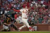 FILE -St. Louis Cardinals' Corey Dickerson watches his grand slam as Pittsburgh Pirates catcher Jason Delay, left, kneels at the plate during the first inning of a baseball game Saturday, Oct. 1, 2022, in St. Louis. Outfielder Corey Dickerson and the Washington Nationals have agreed to a one-year contract, pending the successful completion of a physical exam, a person familiar with the deal told The Associated Press on Tuesday. Jan. 10, 2023. (AP Photo/Jeff Roberson, File)