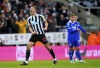 Newcastle United's Dan Burn celebrates scoring during the League Cup quarterfinal soccer match between Newcastle United and Leicester City at St. James' Park, Newcastle, England, Tuesday Jan. 10, 2023. (Owen Humphreys/PA via AP)
