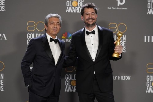 Ricardo Darin, left, and Santiago Mitre pose in the press room with the award for best motion picture, foreign language for 
